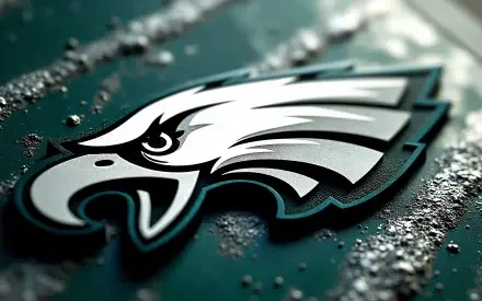 Philadelphia Eagles NFL logo embossed on wet, textured dark green surface, 4K Ultra HD PC desktop wallpaper/background.