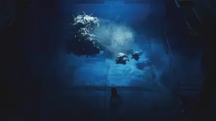 End of Abyss underwater scene: deep ocean reef lit by blue light, two divers by a coral outcrop with rising bubbles — HD PC desktop wallpaper/background.