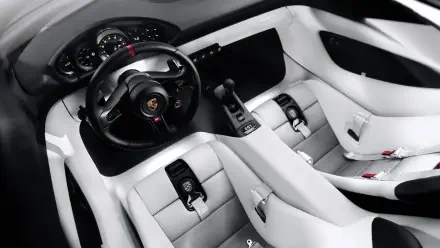 5K Ultra HD Porsche Mission S desktop wallpaper showing a futuristic white car interior with a black steering wheel and digital controls.