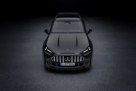 Mercedes-AMG GT SUV viewed from the front in a dark studio, 2K Quad HD PC desktop wallpaper and background.