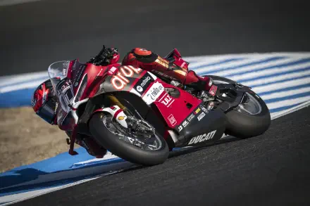 Ducati Panigale V4 R motorcycle racing through a circuit corner, HD desktop wallpaper and background