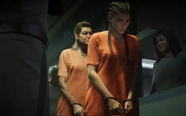 4K Ultra HD PC desktop wallpaper: Grand Theft Auto VI scene showing Lucia Caminos in an orange jumpsuit, handcuffed and escorted through a dim prison corridor (video game background).