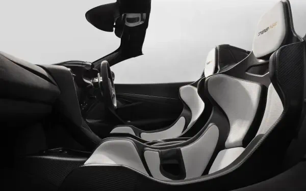 8K Ultra HD PC desktop wallpaper: McLaren 788HS vehicle interior with sleek black-and-white carbon-fiber racing seats and cockpit.