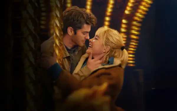 We Live in Time — 4K Ultra HD PC desktop wallpaper/background: couple embracing and kissing beneath warm, blurred carousel lights, evoking a romantic, nostalgic atmosphere.