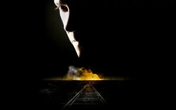 24 — 4K Ultra HD PC desktop wallpaper: shadowed face overlooks railway tracks leading toward a glowing fire in the distance on a stark black background.