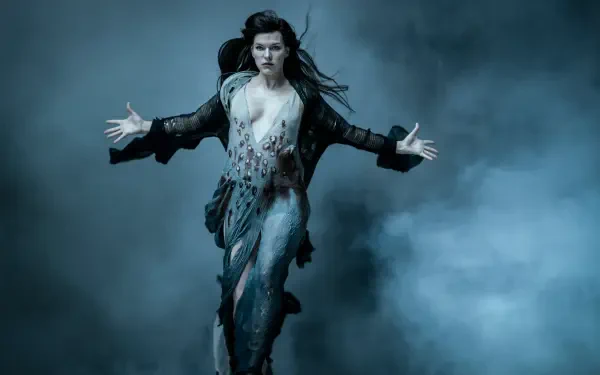 Actress from Hellboy (2019) descending through mist in a torn costume with arms outstretched — 5K Ultra HD PC desktop wallpaper/background.