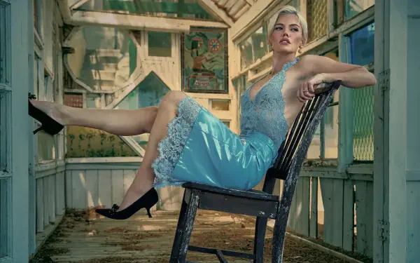 Female singer in a lace blue dress reclining on a chair in a sunlit screened porch, 5K Ultra HD PC desktop wallpaper and background with a music-themed, performative mood.