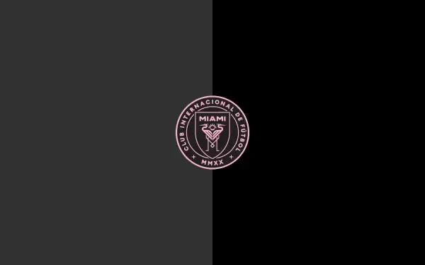 Inter Miami CF logo centered on a split dark-gray and black background — minimalist 2K Quad HD PC desktop wallpaper/background.