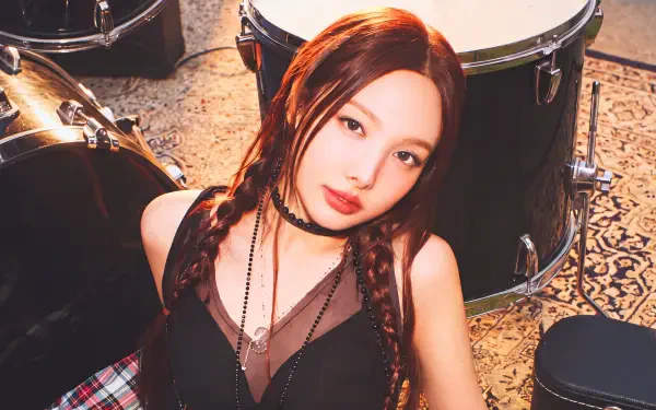 TWICE singer Nayeon in a goth-inspired outfit beside drums, 5K Ultra HD PC desktop wallpaper and background.