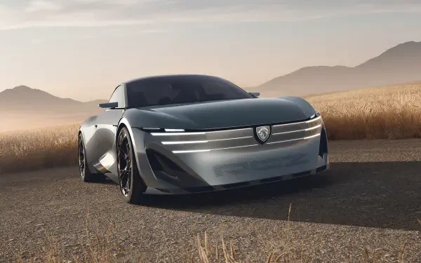 Peugeot RCZ Vision electric concept car on a desert road, shown in HD desktop wallpaper.