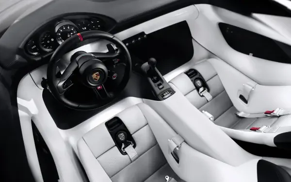 5K Ultra HD Porsche Mission S desktop wallpaper showing a futuristic white car interior with a black steering wheel and digital controls.
