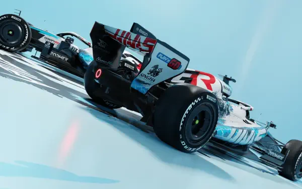Haas F1 Team’s VF-26 Formula 1 race car on a blue track, featured in an HD PC desktop wallpaper.