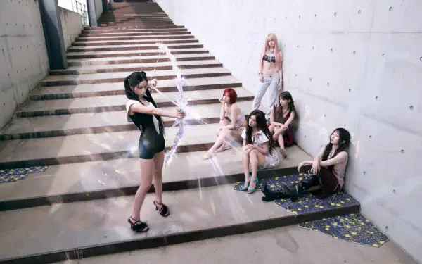 NMIXX Strange Muse 4K Ultra HD desktop wallpaper featuring women on concrete stairs, including a woman in a black swimsuit.