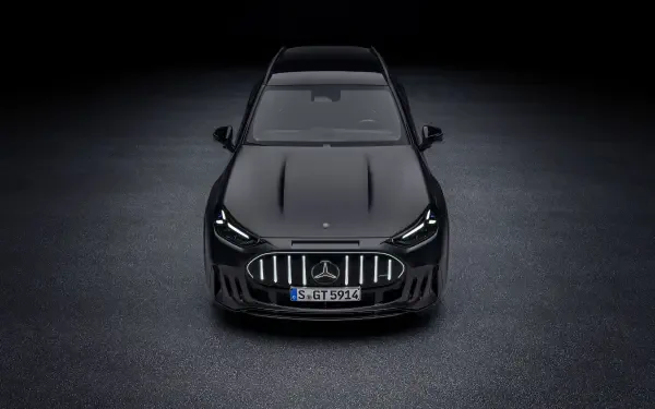 Mercedes-AMG GT SUV viewed from the front in a dark studio, 2K Quad HD PC desktop wallpaper and background.