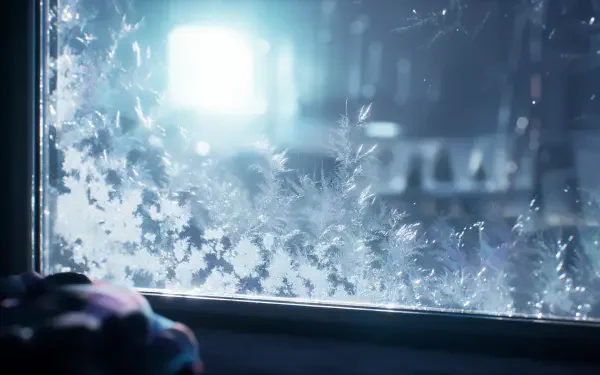 4K Ultra HD PC desktop wallpaper of a frosty window covered in snow, glowing with cool winter light.