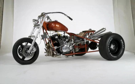 HD desktop wallpaper featuring a custom three-wheeled motorcycle trike with a sleek, low-profile design and chrome accents against a white background.