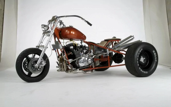 HD desktop wallpaper featuring a custom three-wheeled motorcycle trike with a sleek, low-profile design and chrome accents against a white background.