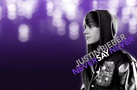 HD desktop wallpaper featuring Justin Bieber with the text NEVER SAY NEVER against a purple bokeh background.