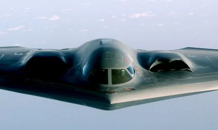 A high-definition wallpaper featuring a stealth military aircraft soaring through the sky, showcasing its sleek design and advanced engineering.