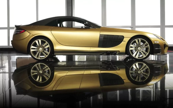 Gold Mercedes-Benz SLR McLaren sports car in profile with mirrored reflection on a glossy floor, showcased against tall windows — HD PC desktop wallpaper.