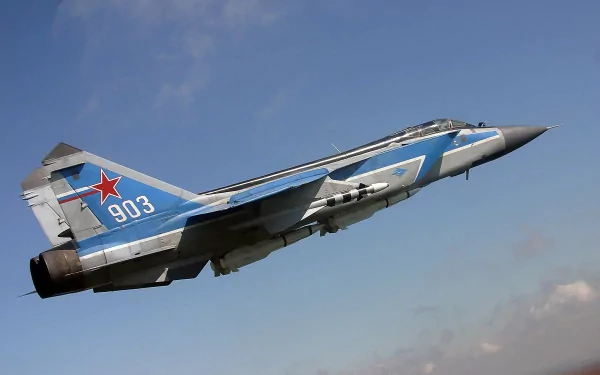 HD desktop wallpaper featuring a Mikoyan MiG-31 military jet fighter warplane soaring against a clear blue sky.