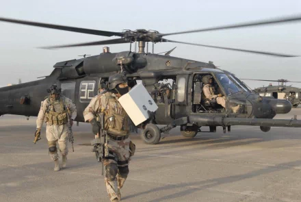 Military personnel disembark from a Sikorsky UH-60 Black Hawk helicopter in a high-resolution 4K Ultra HD desktop wallpaper and background.