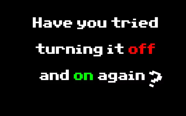 HD wallpaper with Have you tried turning it off and on again? text referencing The IT Crowd series on a black background.