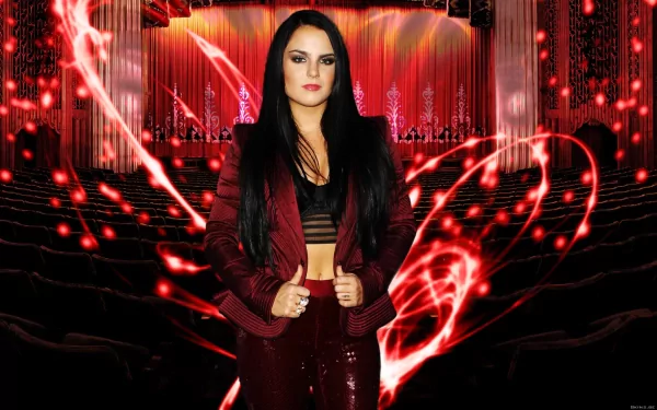 HD desktop wallpaper featuring singer JoJo in a red outfit standing confidently against a vibrant stage background with swirling red light effects, highlighting a music theme.
