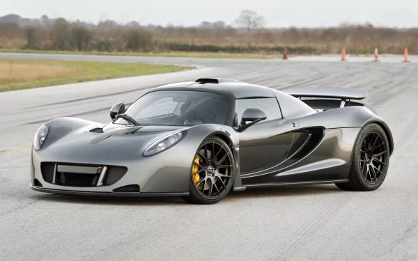 Silver Hennessey Venom GT supercar parked on a track, captured in high-definition for a PC desktop wallpaper background.
