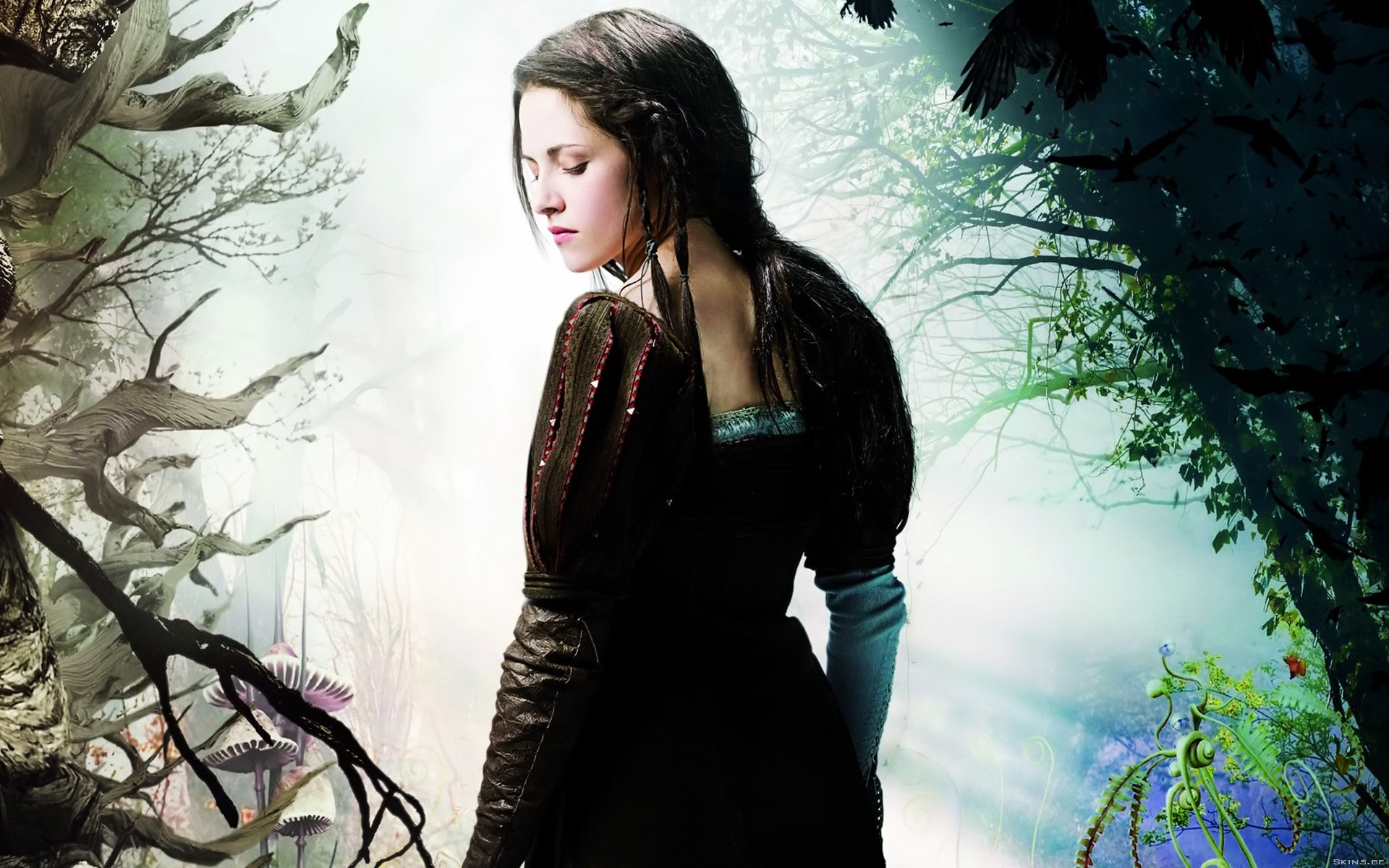 A stunning HD desktop wallpaper featuring Kristen Stewart, portrayed in a mystical setting surrounded by dark forests and ethereal elements, capturing a captivating and enchanting moment.