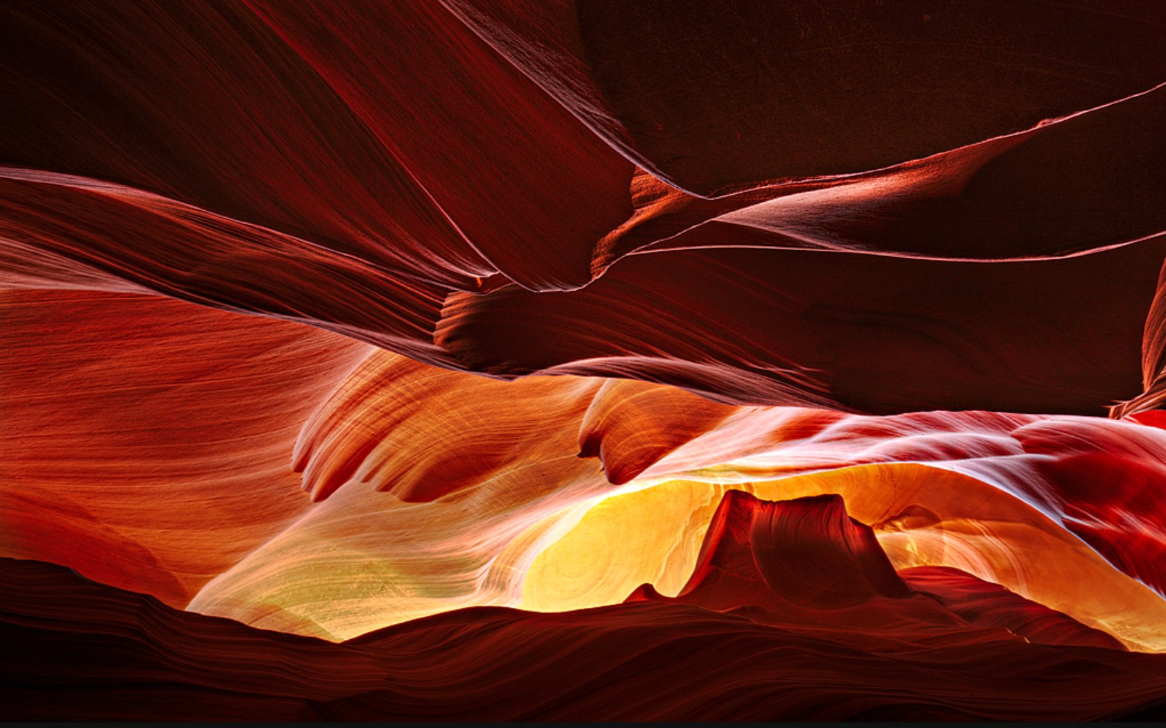 HD desktop wallpaper showcasing the smooth, flowing rock formations and vibrant colors of Antelope Canyon in nature.
