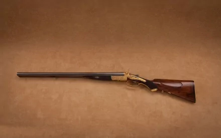 HD desktop wallpaper featuring a detailed man-made shotgun with a wooden stock and long barrel against a plain brown background.