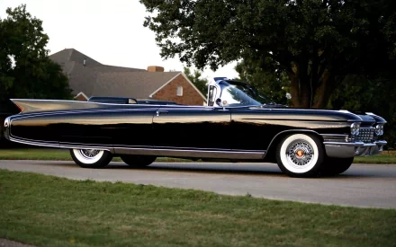 1960 Cadillac Eldorado convertible parked outdoors, featured as an HD PC desktop wallpaper showcasing its classic vehicle design.