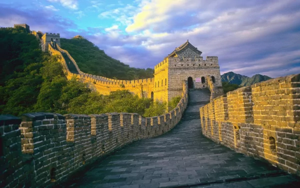 A breathtaking view of the Great Wall of China, capturing its majestic structure and surrounding landscape under a vibrant sky. An ideal HD wallpaper to enhance your desktop background.