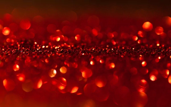 An abstract 4K Ultra HD background featuring a rich tapestry of red hues and shimmering bokeh, creating a vibrant and dynamic visual experience.
