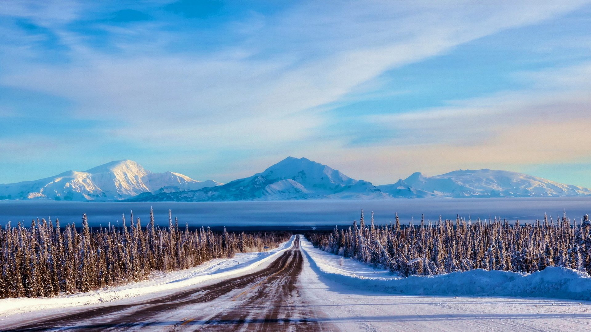 Serene Winter Road Leading to Majestic Mountains - HD Wallpaper ...