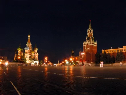 A stunning 4K Ultra HD image of a man-made palace at night, featuring intricate architecture and vibrant lighting, showcasing the grandeur of St. Basil's Cathedral and the Kremlin.