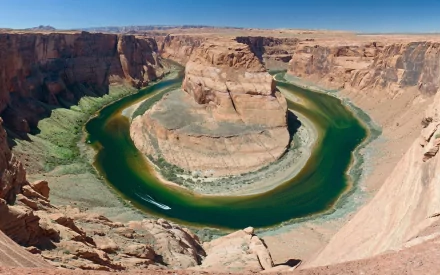 HD PC desktop wallpaper and background: Horseshoe Bend nature scene — aerial view of the Colorado River looping around a sandstone meander beneath a clear blue sky.