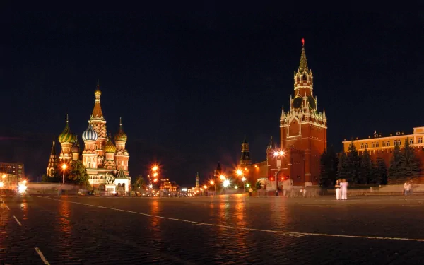 A stunning 4K Ultra HD image of a man-made palace at night, featuring intricate architecture and vibrant lighting, showcasing the grandeur of St. Basil's Cathedral and the Kremlin.