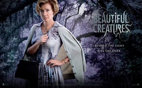 HD wallpaper from the movie Beautiful Creatures, featuring a woman in a stylish dress against a mystical forest backdrop, with the tagline, Beyond the Light Lies the Dark.