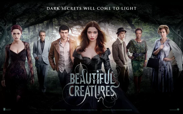 A dramatic scene from the movie Beautiful Creatures, featuring the main characters surrounded by a mystical forest, with the tagline Dark secrets will come to light.