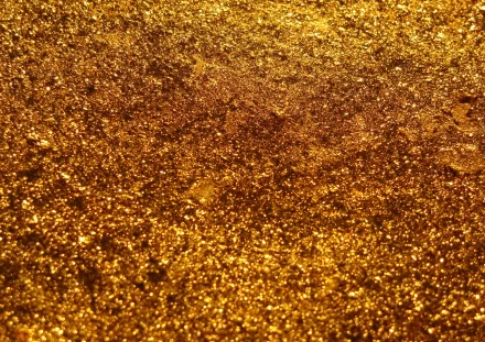 HD abstract metal texture in rich gold tones, featuring a rough and shimmering surface for a visually striking PC desktop wallpaper and background.