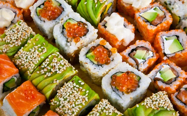 A vibrant assortment of sushi rolls, featuring a variety of colors and textures, displayed beautifully as an HD PC desktop wallpaper and background.