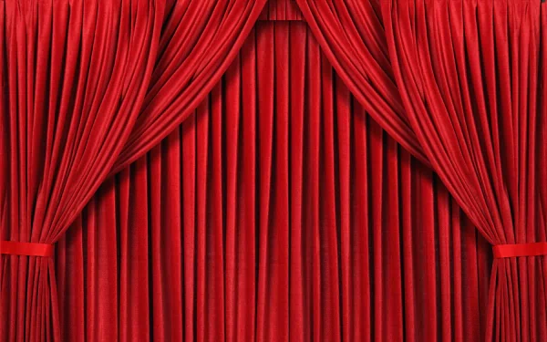An abstract HD desktop wallpaper featuring rich red curtains with elegant folds, creating a dramatic and vibrant background for any computer screen.