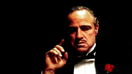 HD desktop wallpaper featuring Marlon Brando as Vito Corleone from The Godfather, capturing the iconic celebrity role with dramatic lighting and intense expression.