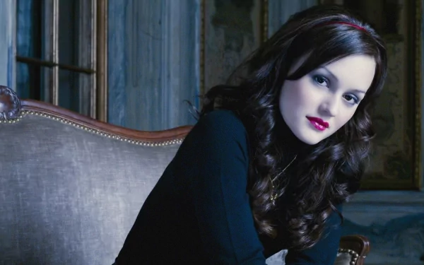 HD PC desktop wallpaper featuring celebrity Leighton Meester seated on a vintage couch with dark, moody lighting and a classic background.