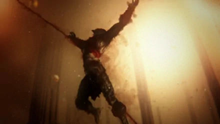 Kratos silhouette clutching chained blades, leaping through dust and golden light — God of War: Ascension HD PC desktop wallpaper/background.