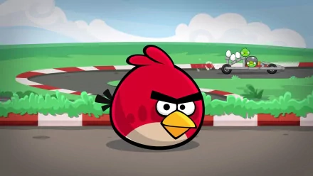 HD PC desktop wallpaper featuring Heikki as a red bird character from the Angry Birds video game in a racing scene with green grassy surroundings and a track.