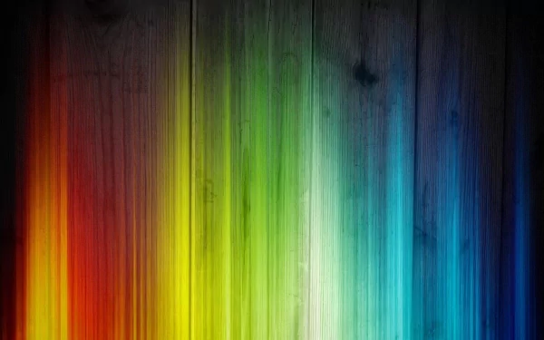 Colorful abstract pattern featuring vibrant rainbow hues on a textured wood background, designed as a high-definition PC desktop wallpaper.