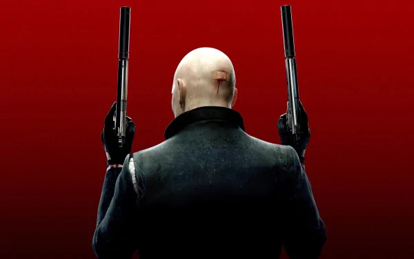 A striking HD desktop wallpaper featuring the iconic character from *Hitman: Absolution*, shown from behind, holding two pistols against a bold red background.